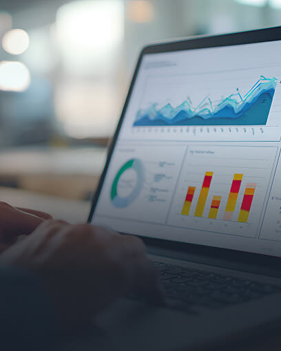 Laptop displaying data charts and graphs representing research reports and scientific analysis.